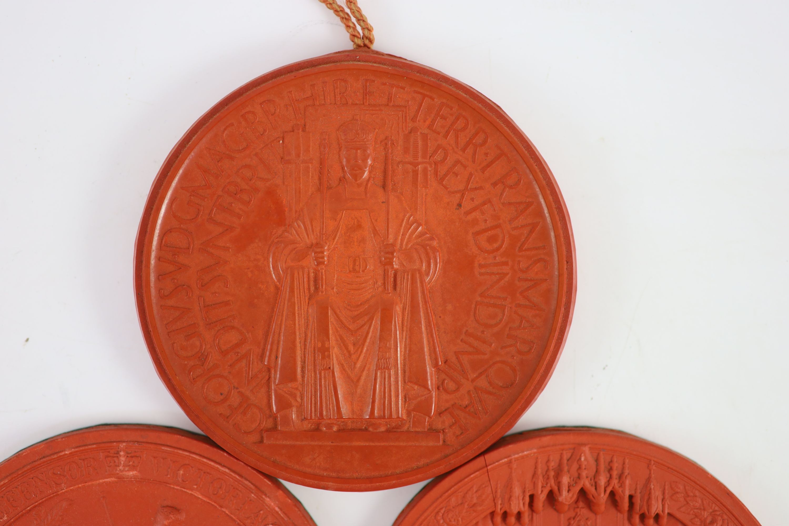 Three red wax Great Seals, two Queen Victorian Great Seals of the Realm, and a George V seal, 16.5 and 16 cm diameter
